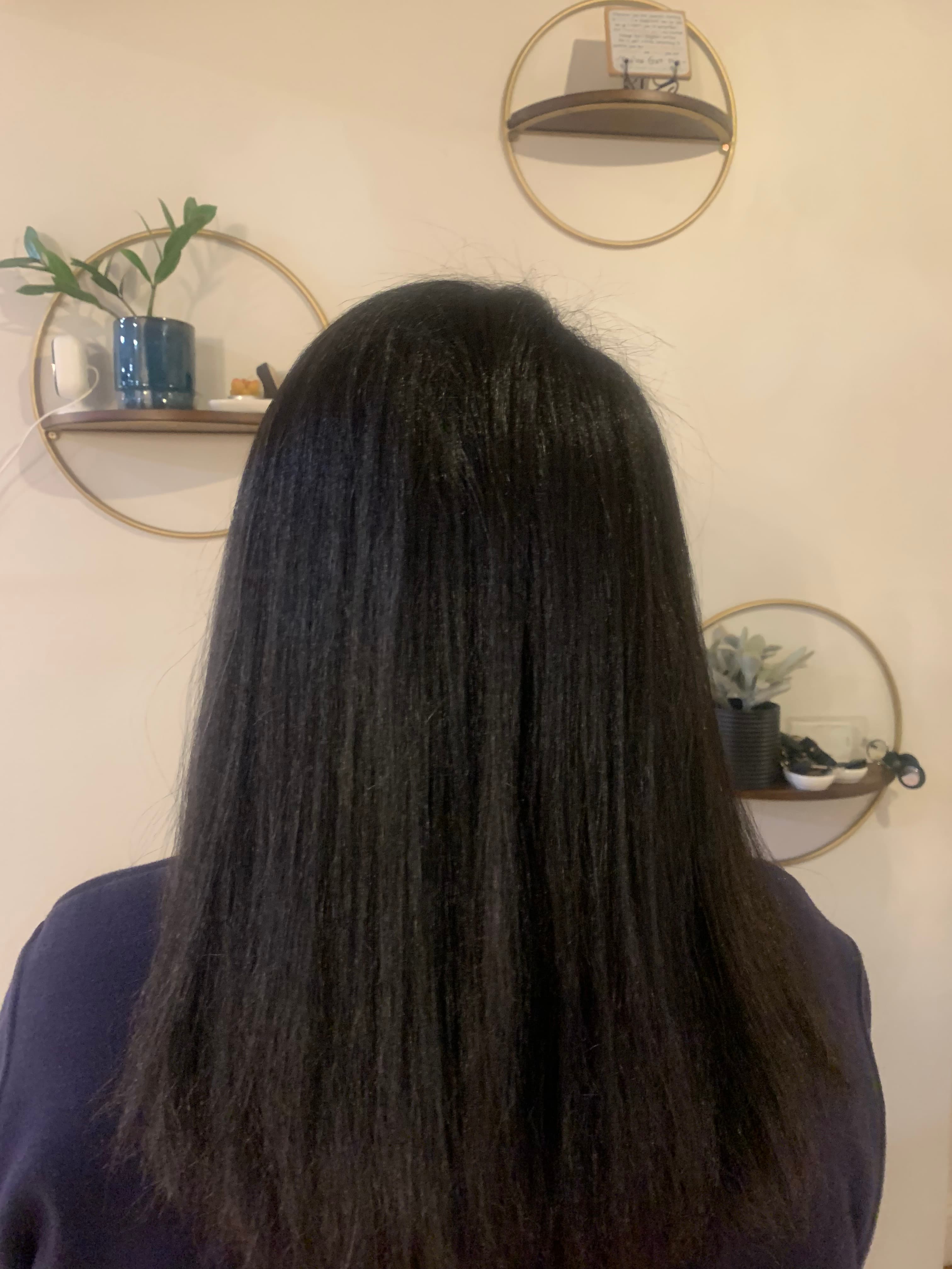 Long dark hair with a smooth straightened finish